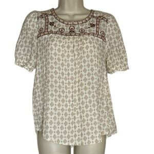 Women’s cream colored short with tan and brown designs size M